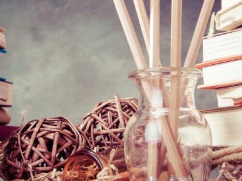 books stacked on a desk with decorative art