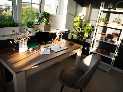 Modern,,Sunlit,Office,Desk,Is,Neatly,Arranged,With,Laptop,,Documents,