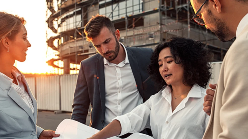 professionals in discussion in an outdoor setting