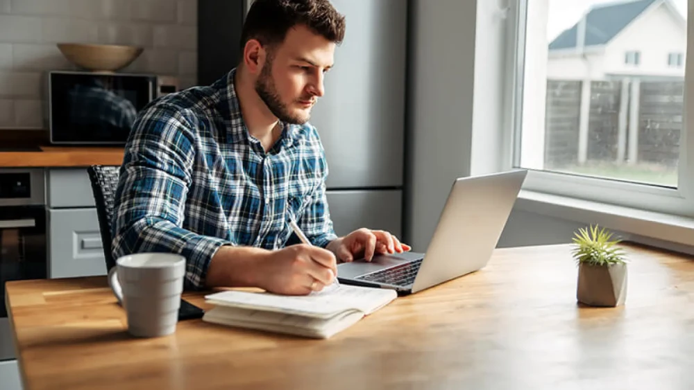 man studying online class at home