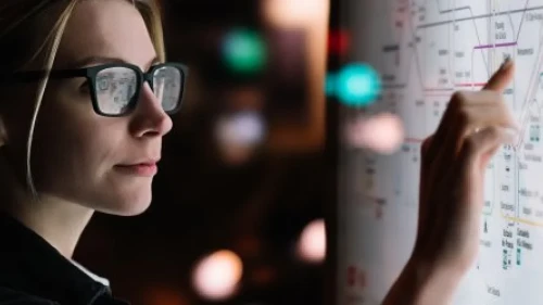 female looking at a digital screen