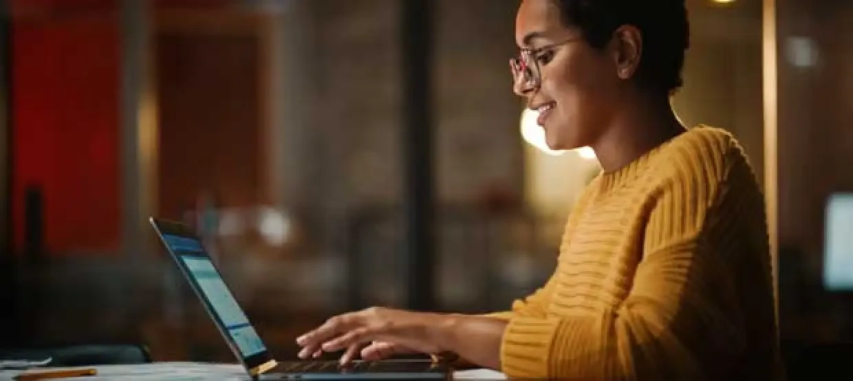 Woman typing on laptop