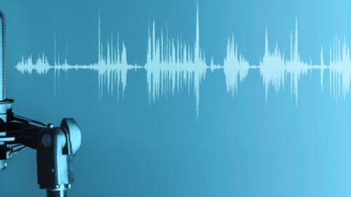 broadcaster's microphone over a blue background with sound waves