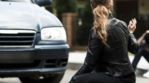 Lady in front of car