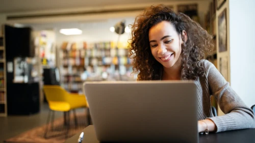 student working in college library