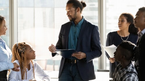 group of business professionals discuss a business plan