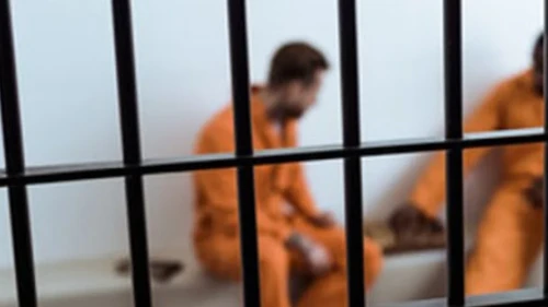 two men in prison cell