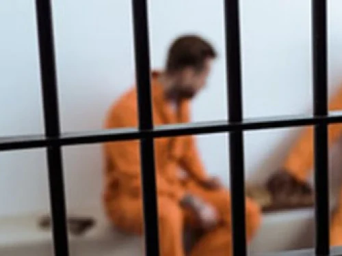 two men in prison cell