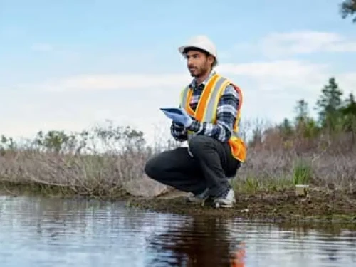 Man collecting data waterside