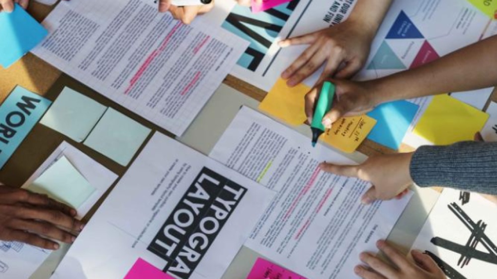 image of group of fashion studies students working on group project collage