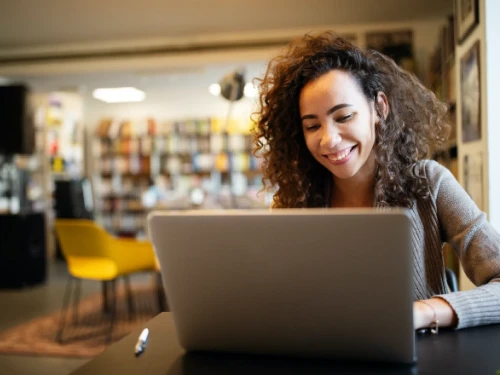 student working in college library
