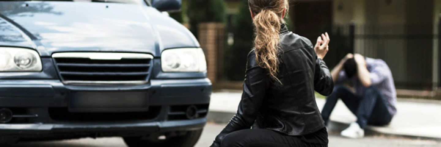Lady in front of car