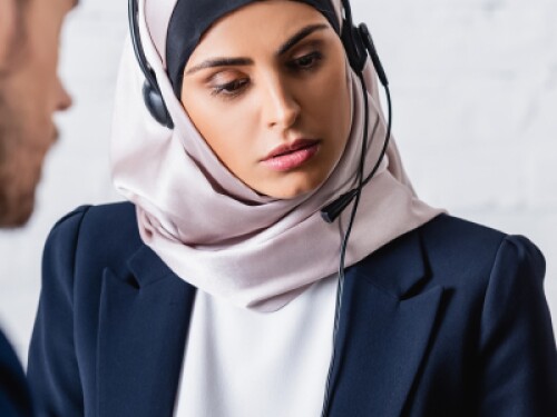 interpreters listening with headsets
