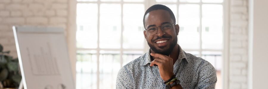 professional with glasses smiling
