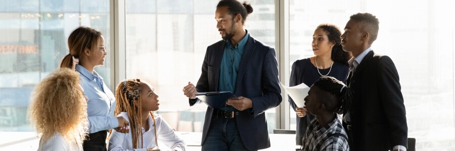 group of business professionals discuss a business plan