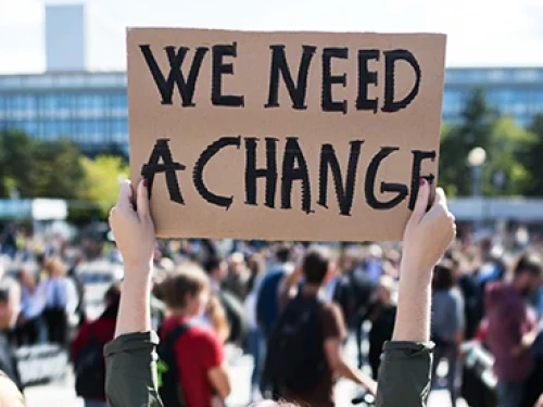 Criminal Justice Reform advocate holding sign
