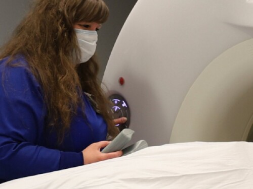 radiologic technician performing diagnostic for computed tomography imaging