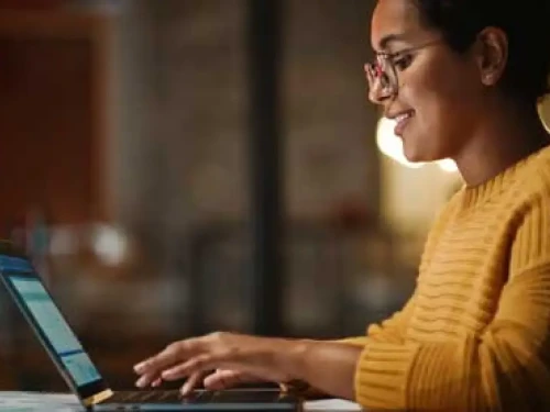 Woman typing on laptop