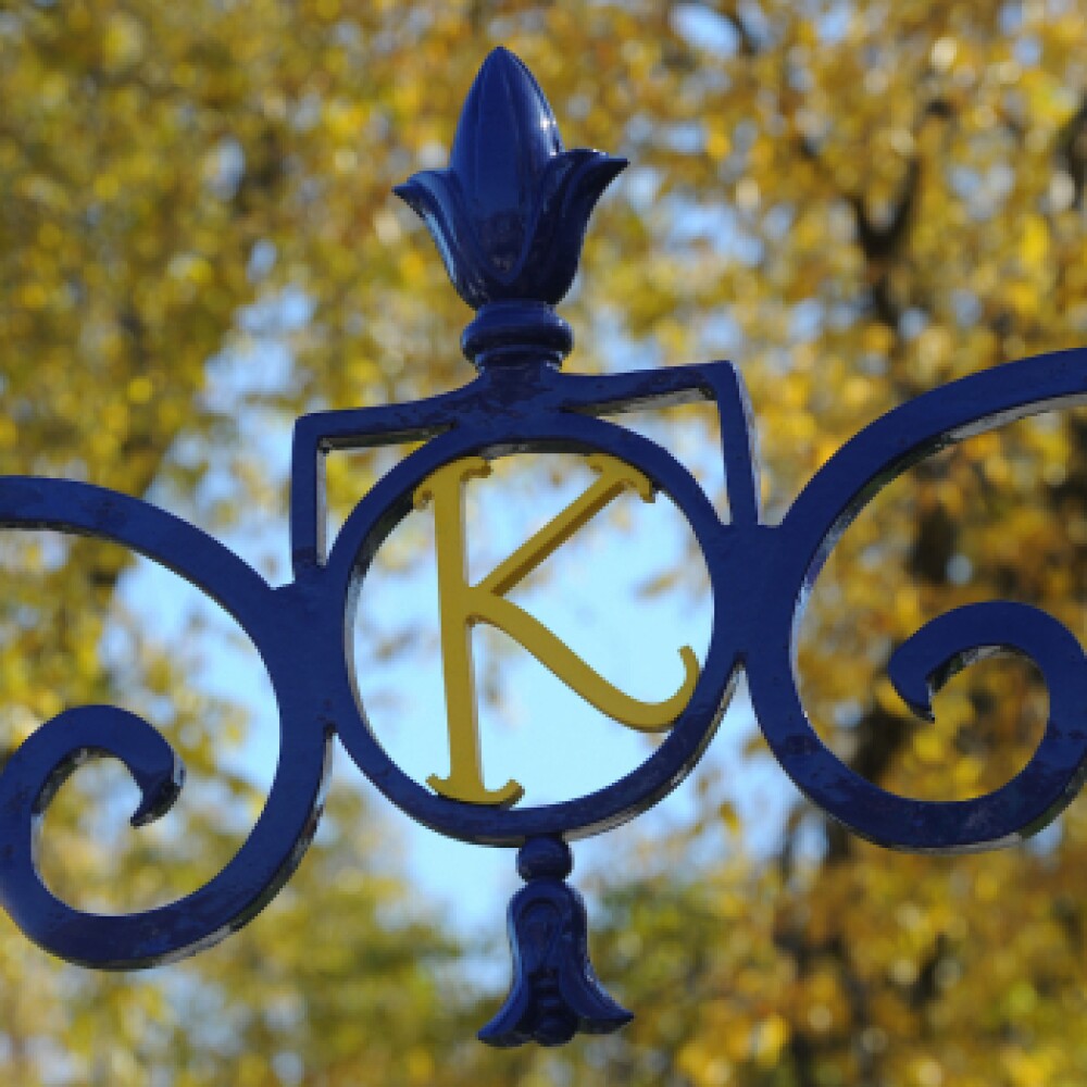 the letter "K" in ironwork of gate