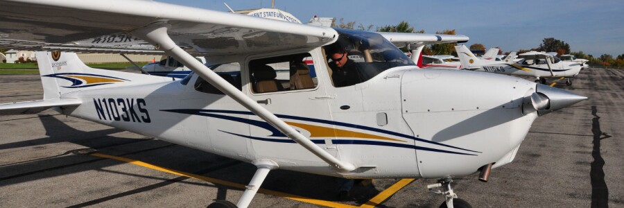 pilot gets into small airplane