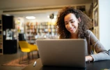 student working in college library