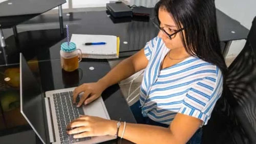 Public Administration student working on a laptop