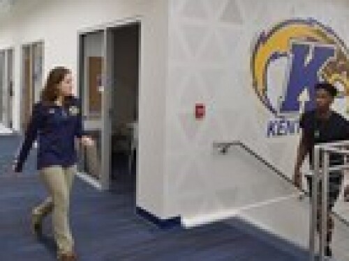 athletic trainers walking through Kent athletic facility