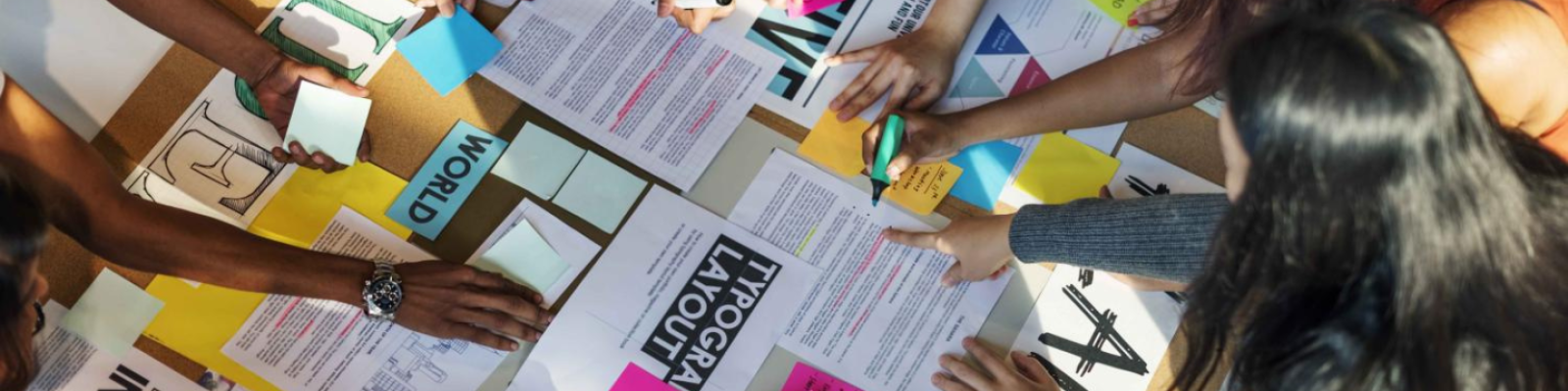 image of group of fashion studies students working on group project collage