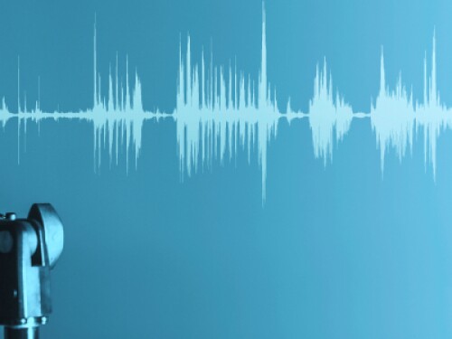 broadcaster's microphone over a blue background with sound waves