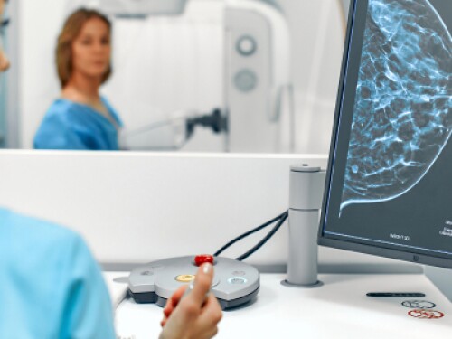 mammographer analyzes image from mammogram